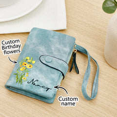 Custom birth flower leather wallet with personalized name – Elegant blue leather wallet with floral engraving, wrist strap, and zippered pocket – Thoughtful and unique birthday gift for her.
