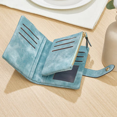 Spacious and stylish blue leather wallet with multiple card slots, secure snap closure, and a zippered coin pouch – Functional and fashionable for everyday use.